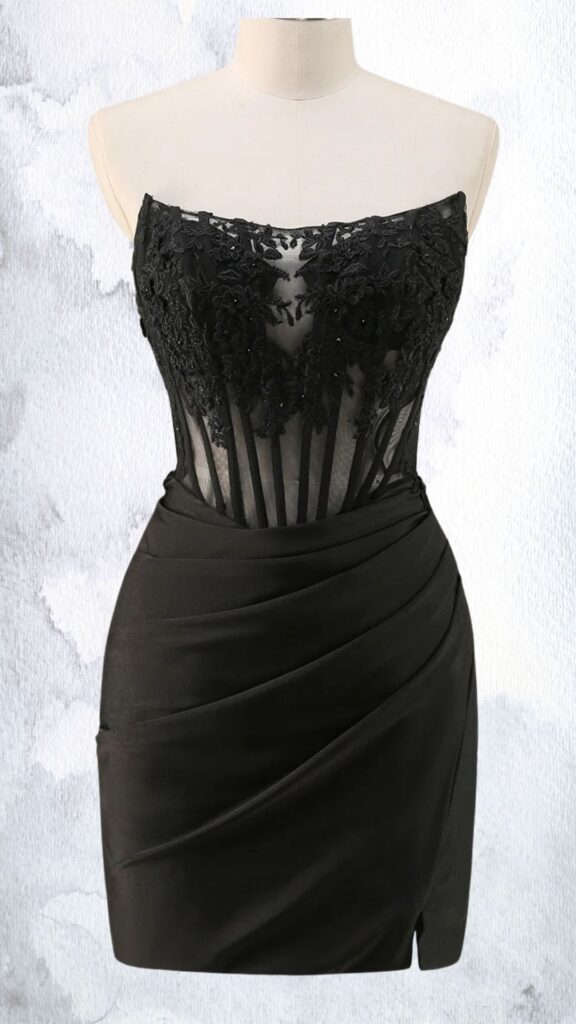 This black mini dress features a fitted silhouette with a strapless, plunging neckline adorned in intricate floral lace embellishments. The bodice is semi-sheer, showcasing a mesh underlay, while the skirt has a sleek draped design that cinches at the waist, ending just above the mid-thigh with a subtle hemline.