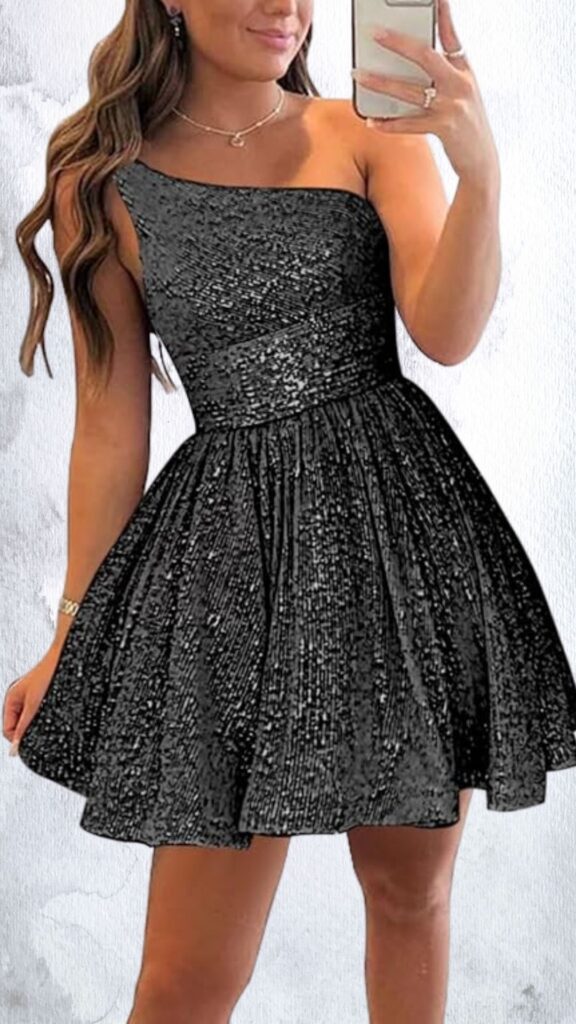 A black mini dress showcases a flattering A-line silhouette, adorned with shimmering sequins that catch the light. It features a one-shoulder neckline and a fitted bodice that transitions into a flared skirt, creating a playful and elegant look. The hemline ends above mid-thigh, enhancing its youthful charm.