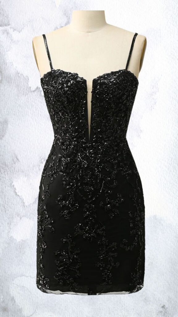 A fitted black mini dress featuring a flattering sweetheart neckline and delicate spaghetti straps, adorned with intricate bead and rhinestone embellishments that create a shimmering floral pattern. The dress hugs the body and ends at mid-thigh, with a subtle sheer hemline that adds elegance and allure. Cutouts at the bust enhance its striking design, making it perfect for formal or festive occasions.