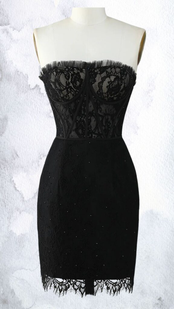 The black mini dress features a fitted silhouette with a strapless, sweetheart neckline adorned with delicate lace and embellishments of beads and sequins. The bodice showcases intricate mesh detailing, tapering to a form-fitting waist, while the hemline is finished with a scalloped lace trim, adding a touch of elegance.