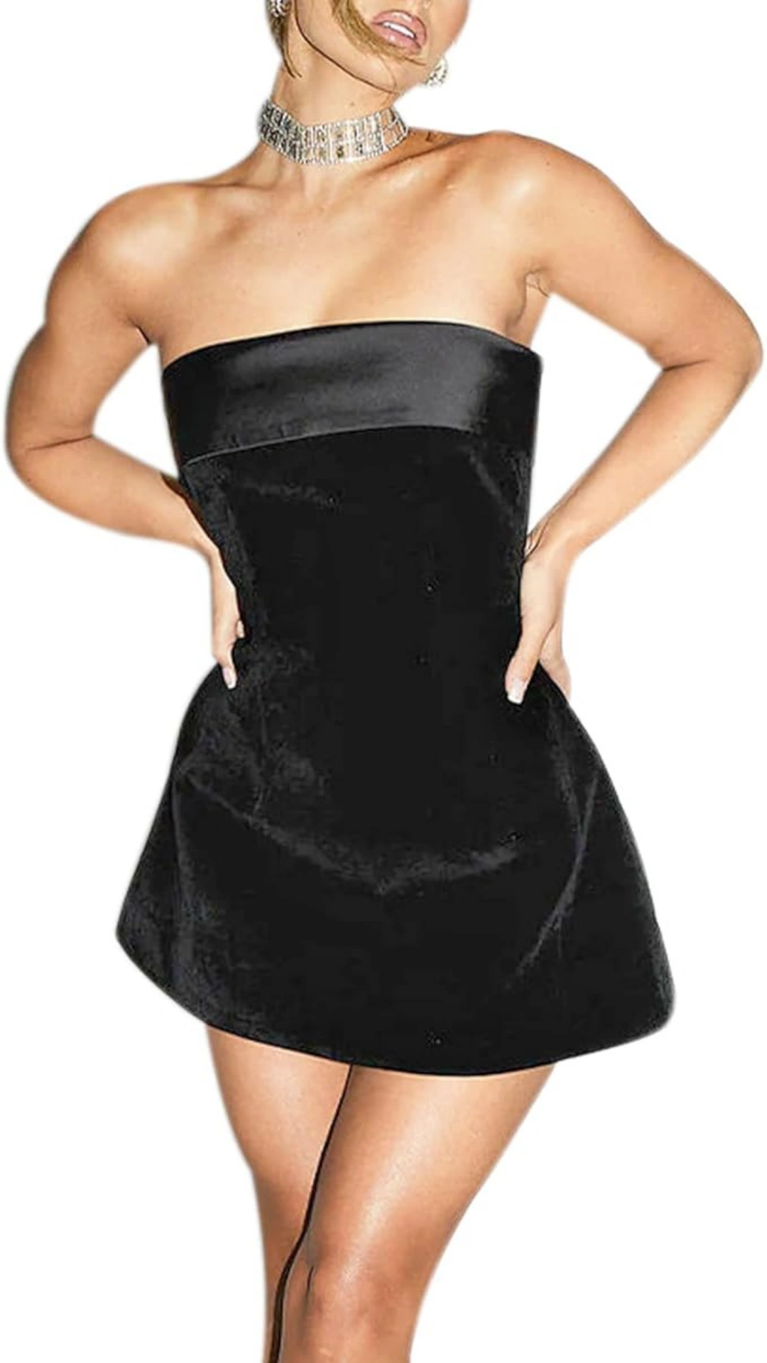 This black homecoming dress features a sleek, strapless design with a fitted bodice and a flared mini skirt, crafted from a smooth velvet fabric that adds a luxurious texture. The overall vibe is trendy and youthful, making it perfect for a homecoming or school dance, designed for teenage girls seeking a chic and bold look.