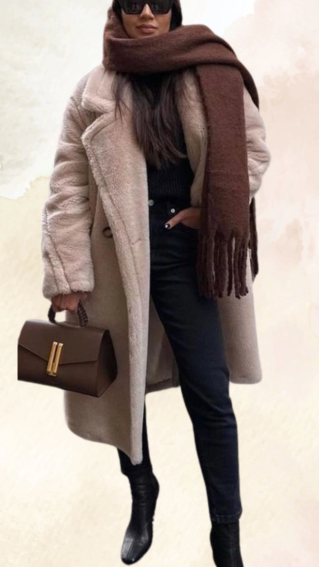 The outfit features a cozy, oversized beige faux fur coat that adds warmth and texture, layered over a fitted black turtleneck. Paired with high-waisted black denim jeans, the look is completed with sleek black ankle boots and a rich brown scarf, emphasizing a casual yet chic fall aesthetic. The combination of neutral tones and layers provides both comfort and style for the season.