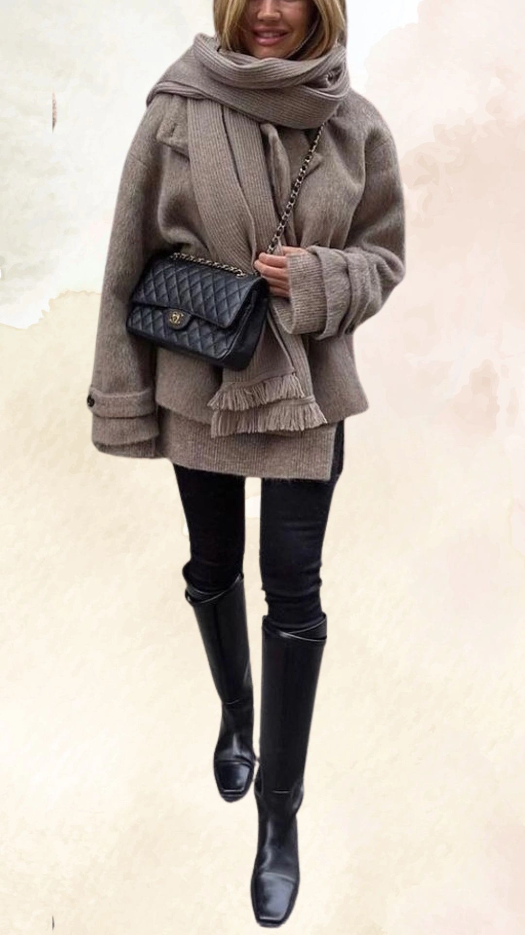 The outfit features an oversized, cozy beige sweater with wide sleeves, layered over a pair of form-fitting black pants. A matching beige knitted scarf is draped around the neck, adding texture, while sleek black knee-high boots complete the ensemble, creating a chic and modern autumn look. The color palette blends warm neutrals with classic black for a versatile fall aesthetic.