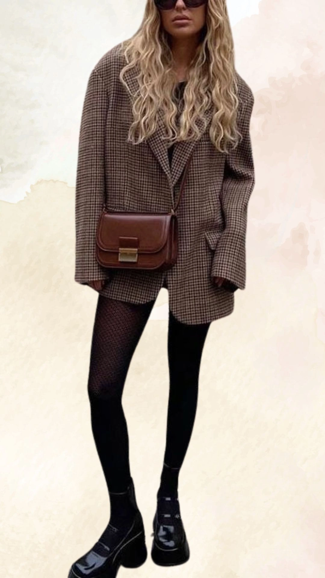 The outfit features an oversized brown and cream houndstooth blazer, providing a relaxed fit. Underneath, a black fitted top is paired with black fishnet tights, creating a layered effect that showcases the contrasting textures. The look is completed with chunky black platform boots and a small brown crossbody bag, perfect for a casual fall ensemble.