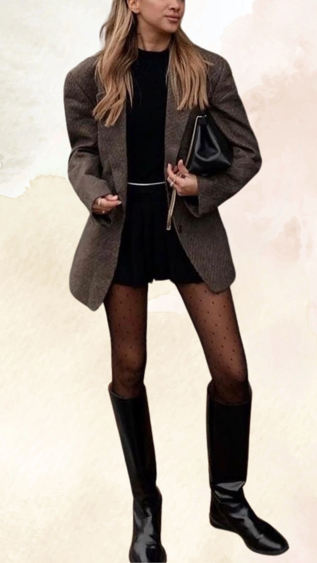 The outfit features a loose-fitting, textured brown blazer with broad shoulders layered over a fitted black top. The look is completed with a black skater skirt, dotted tights, and knee-high black boots, creating a chic and contemporary fall ensemble that balances structure and comfort.