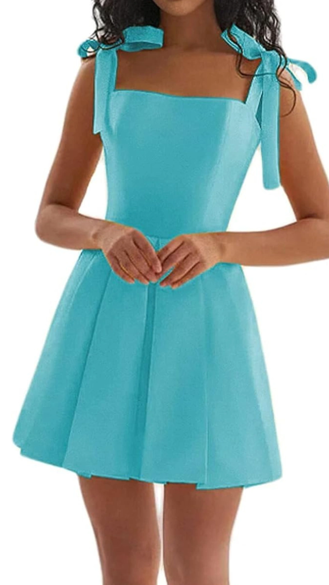 This vibrant aqua blue homecoming dress features a fitted bodice with playful, adjustable shoulder ties and a flared skirt that creates a youthful, fun silhouette. Made from a smooth, structured fabric, the dress offers a trendy, cheerful vibe perfect for teenage girls attending a homecoming or school dance.