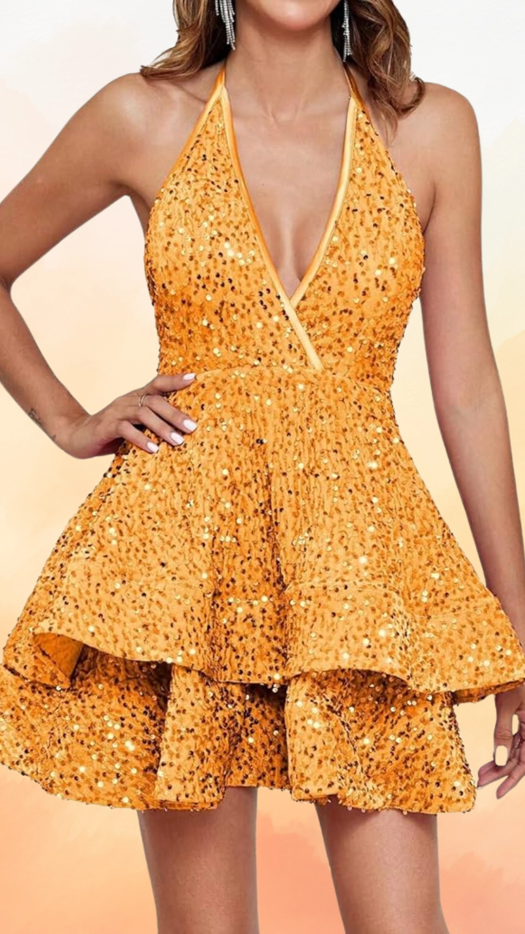 This vibrant halter neck dress features a dazzling orange fabric adorned with shimmering sequins, creating a textured, festive look. With a fitted bodice and a flared, tiered skirt, it exudes a playful and bold vibe, perfect for homecoming or school dances, appealing to teen girls who want to stand out.