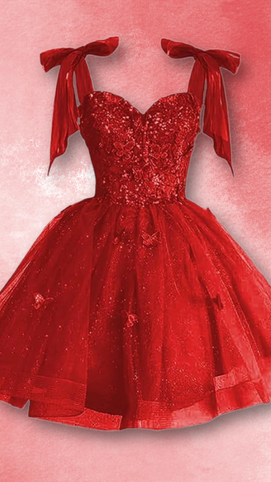 This vibrant red homecoming dress features a fitted, corseted bodice adorned with intricate embellishments, complemented by flowing tulle that creates a voluminous skirt. The playful design is enhanced by delicate bow straps, giving it a romantic and whimsical vibe, perfect for a teenage girl attending a formal event or school dance.